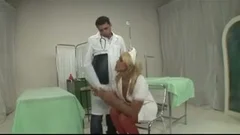 blonde Nurse Curing A Patient