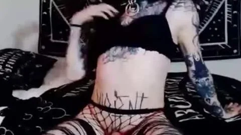 Tattooed Masturbating ladyboy Pleasures Herself