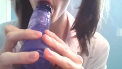 Pigtailed model takes large dildo