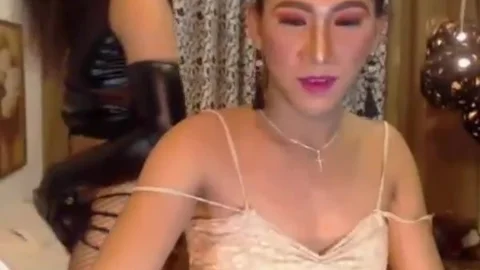 Two nasty shemales suck And jack off On web camera