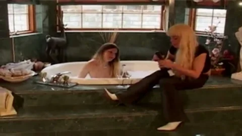 2 blonde Sthis manmales In washroom